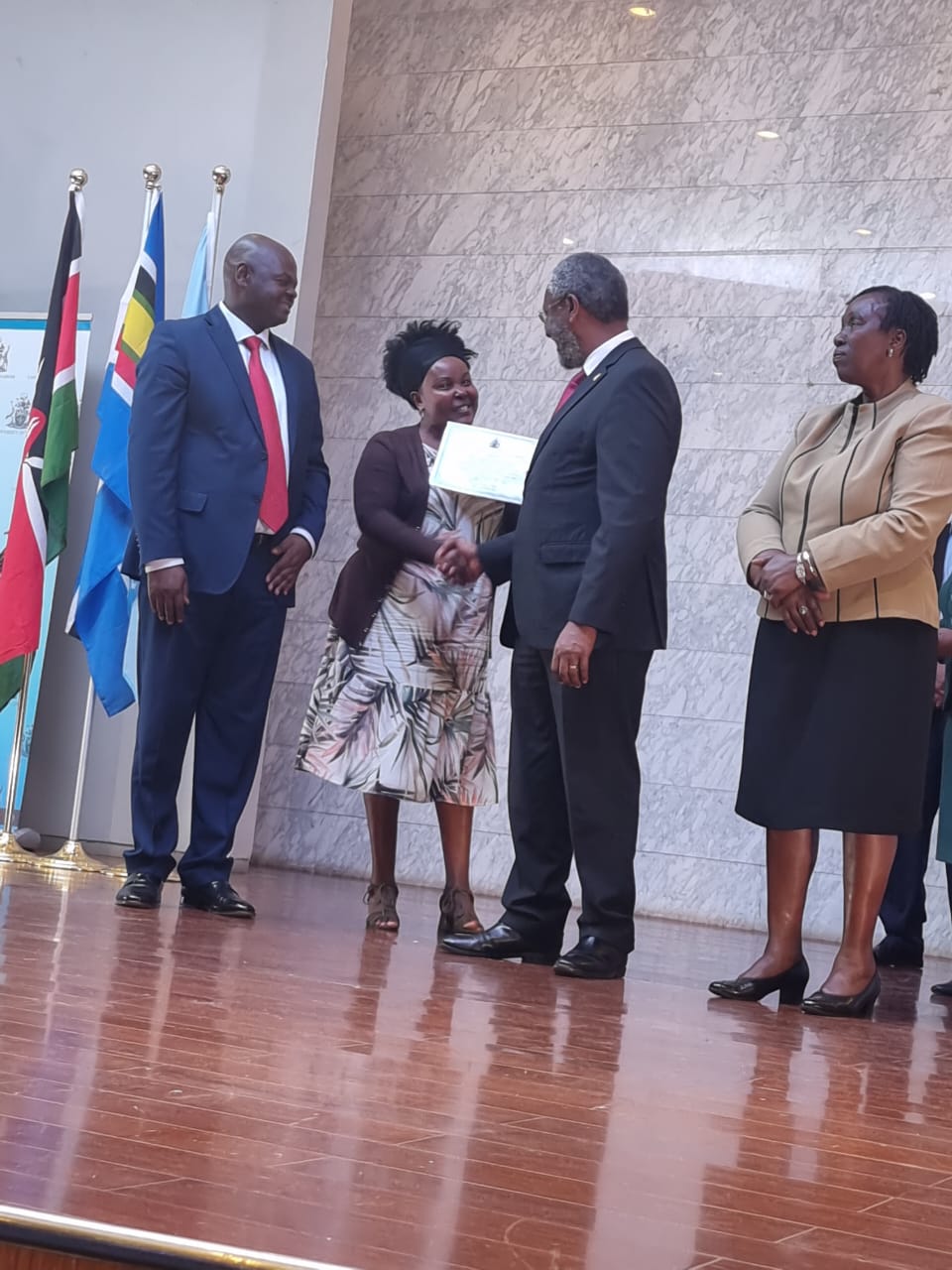 Lilian Muraguri receiving his award 